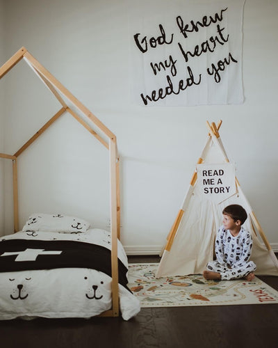 Cozy kid space with house shaped bed frame